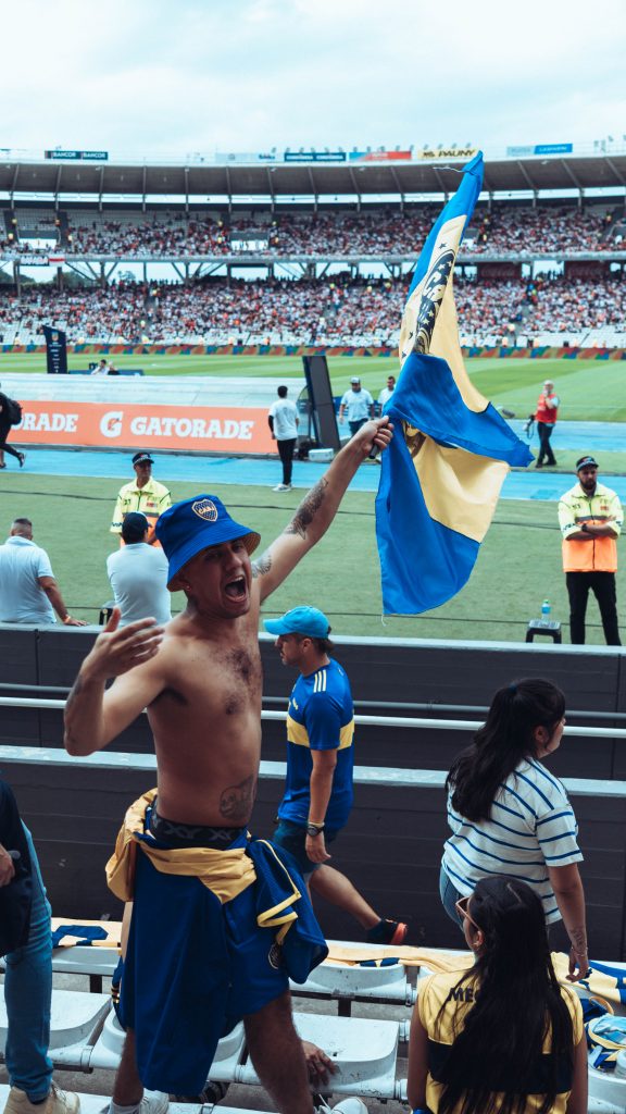 Man celebrating in football stadium
