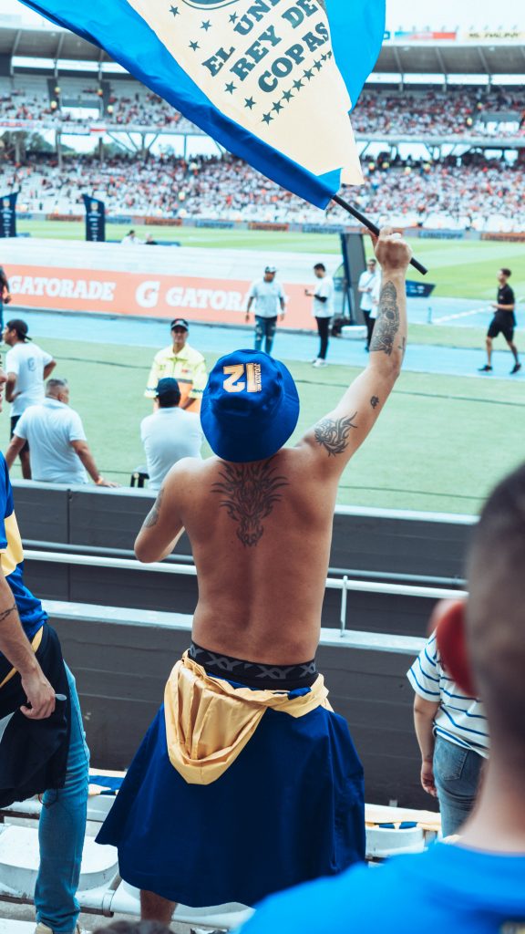 a man celebrating in a football stadium