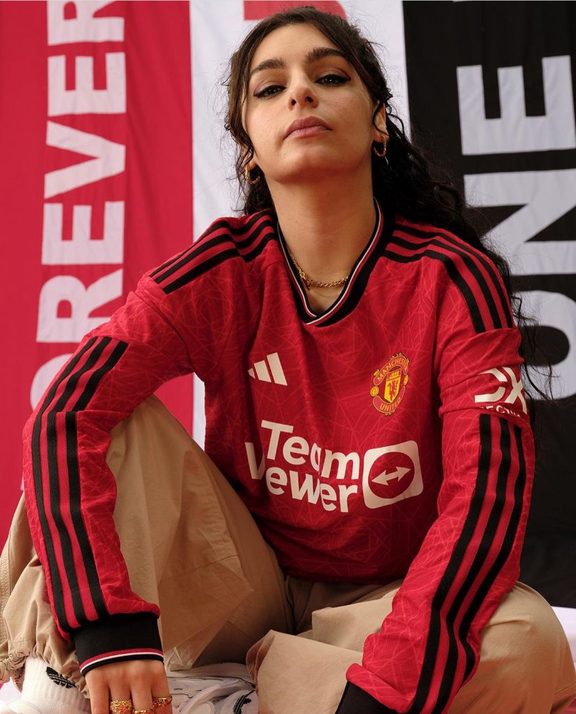 Women dressed in a manchester united football strip