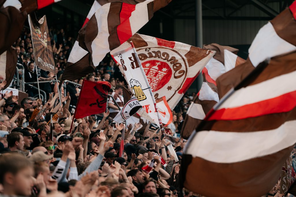 St. Pauli football fans holding flags