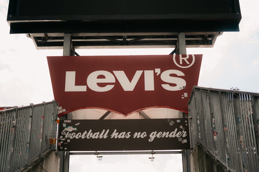A sign hanging in the football stadium.