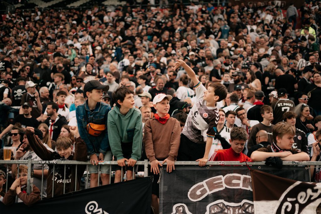 Young St.Pauli fans singing in the stadium.