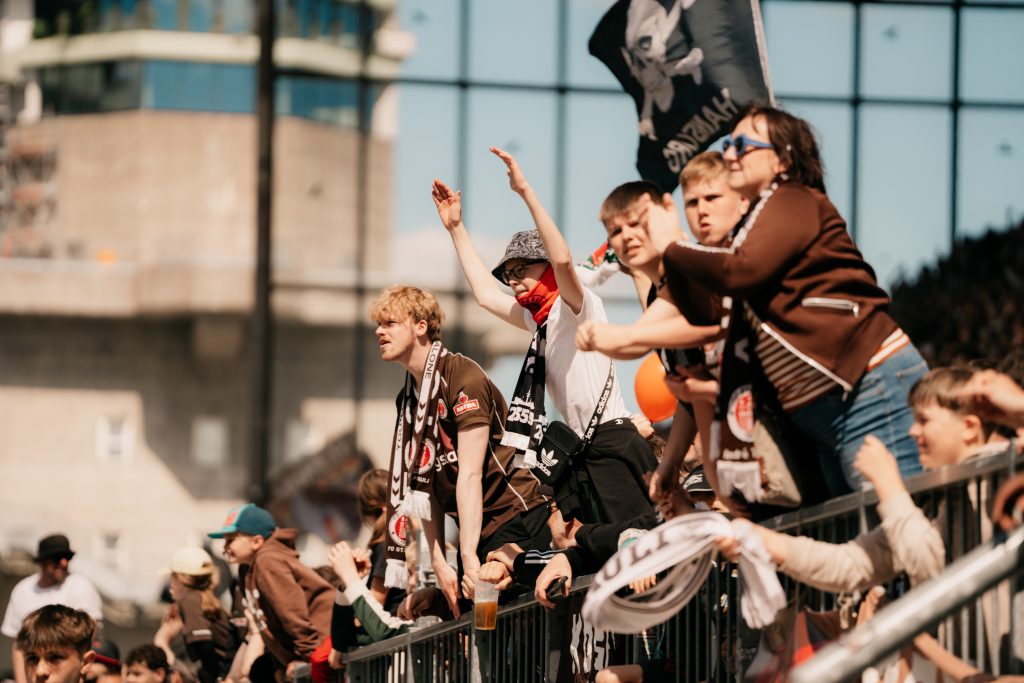 Football fans waving flags.