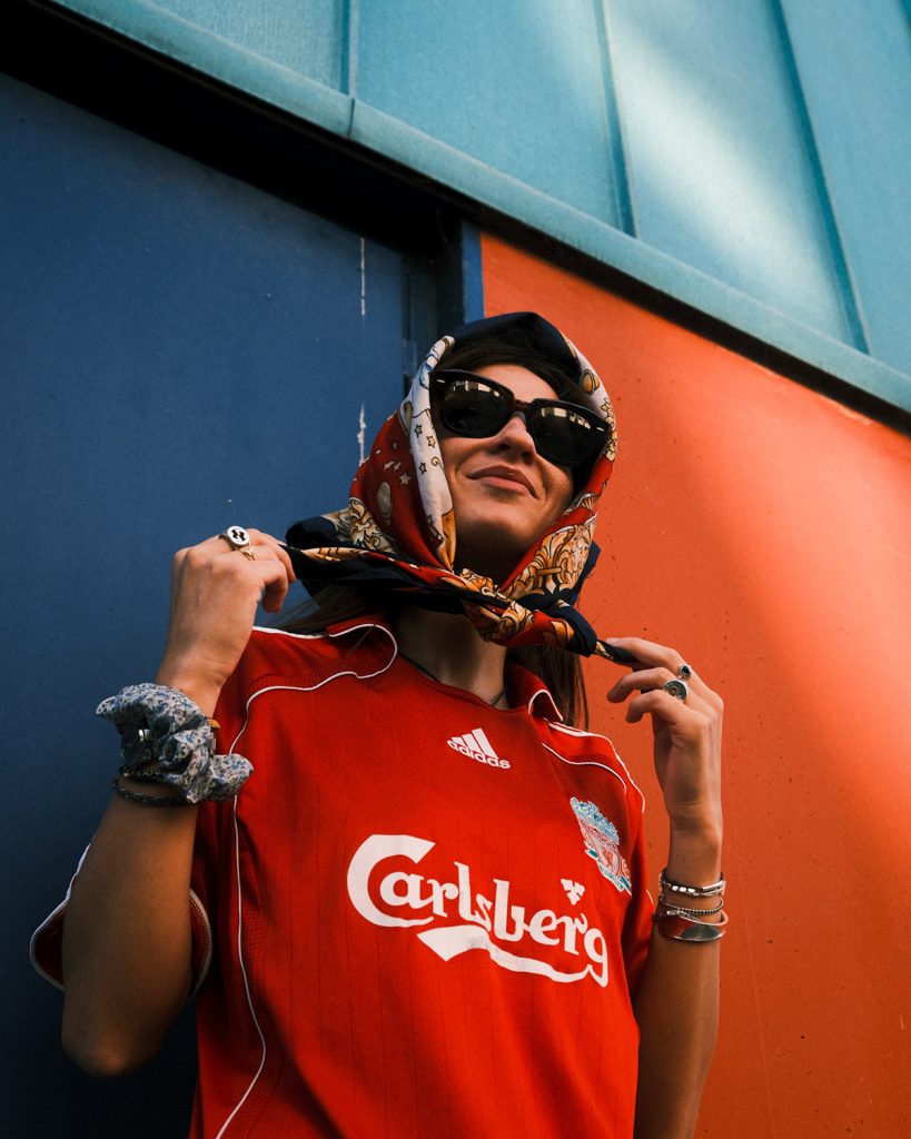 women wearing a scarf and a vintage football jersey.